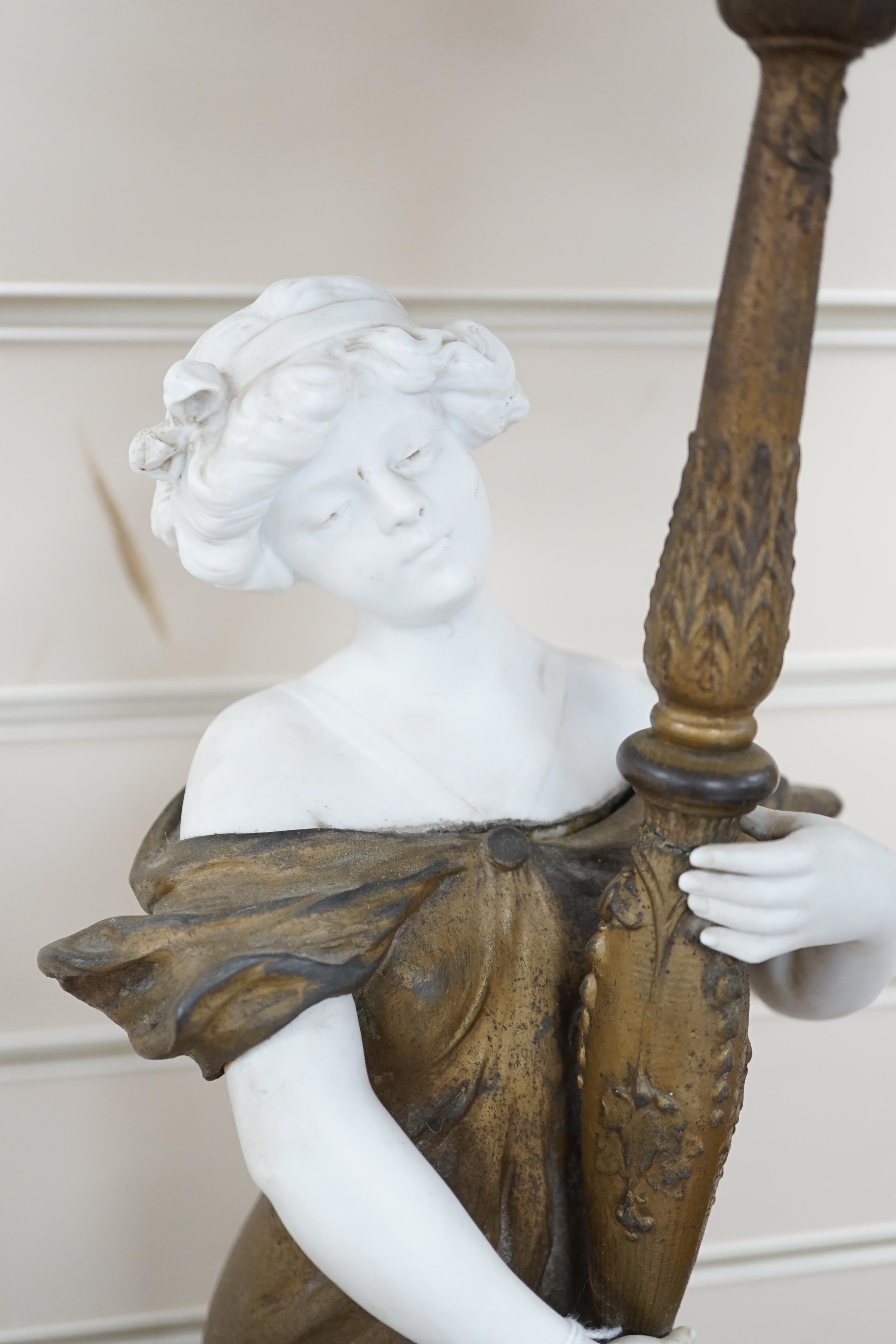 An Art Nouveau gilt-spelter and bisque figural table lamp, on rouge marble base, jewelled gilt-spelter shade, 73cm tall